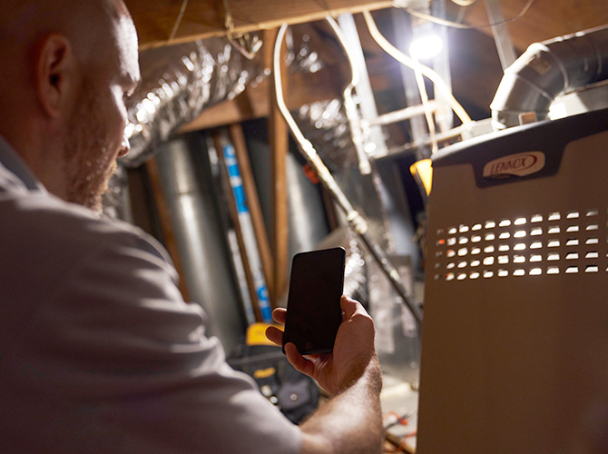 Man working on a Lennox furnace