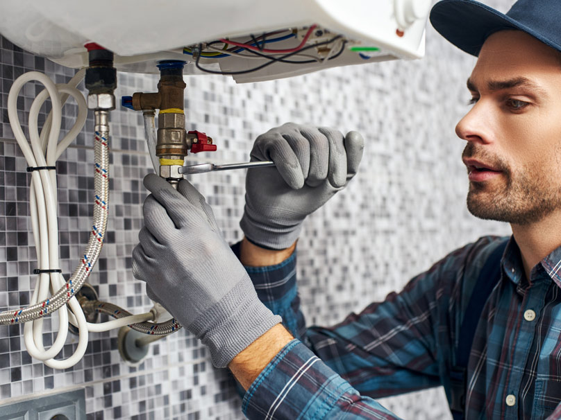 Man working on a water heater